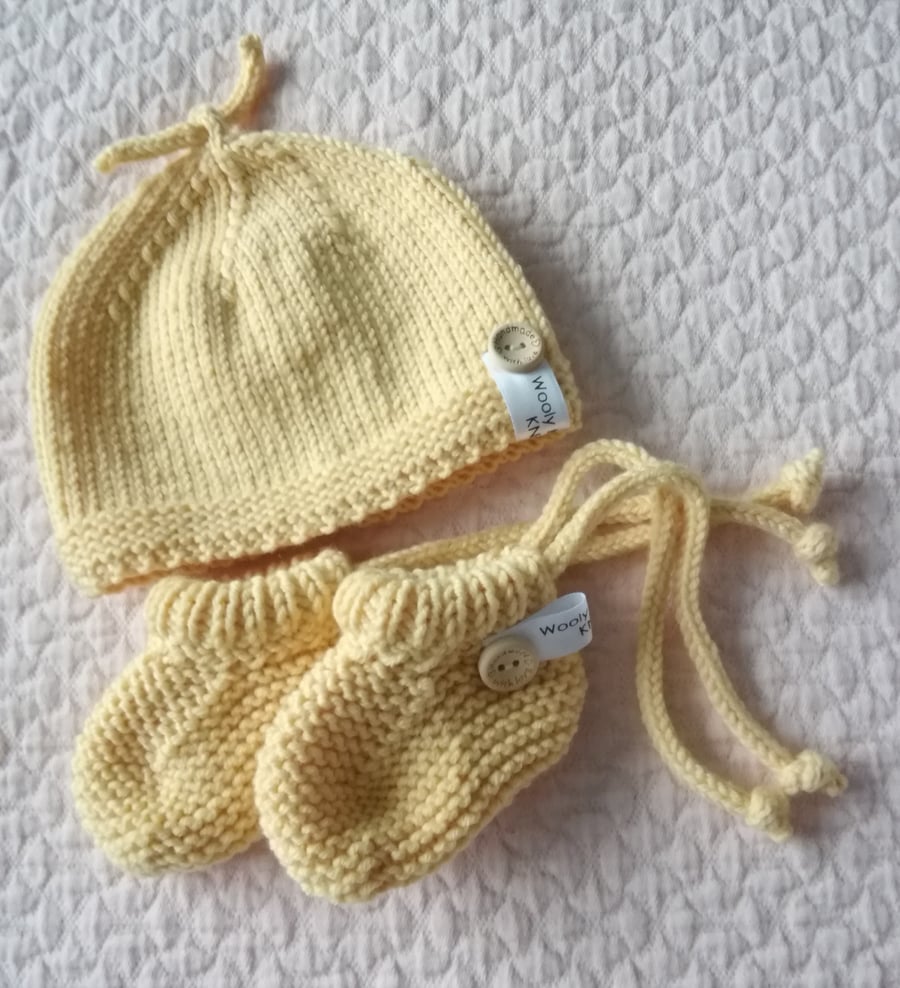 Hand knitted top knot , coming home, babies first hat and bootie gift set