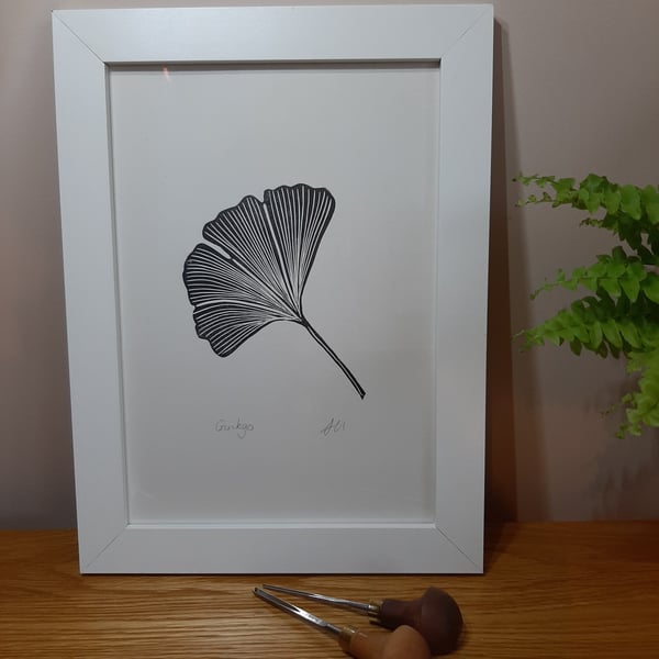 An original linoprint of a single ginkgo leaf. 