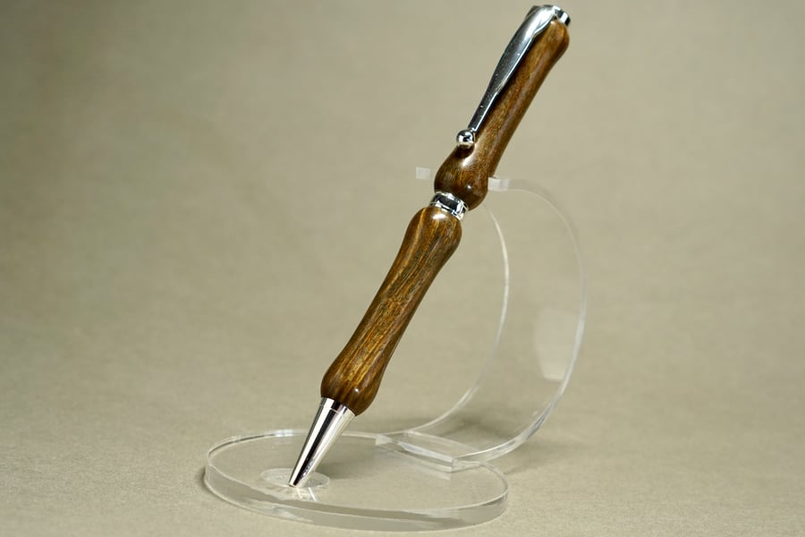 Wood turned ballpoint pen including wooden pen stand.