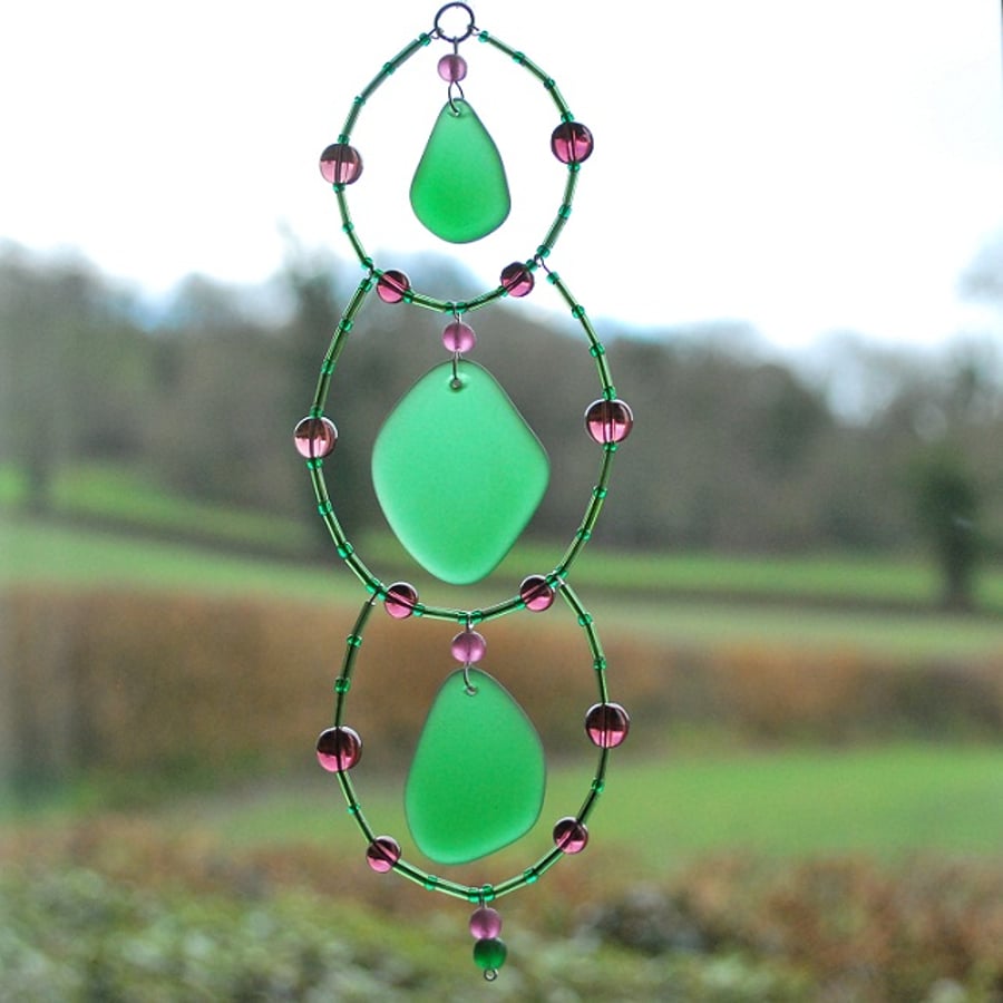 Green beach glass sun catcher with purple beads