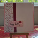 pink flower embossed 'happy birthday' card
