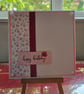 pink flower embossed 'happy birthday' card