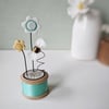 Clay Flowers and Bee on a Vintage Bobbin