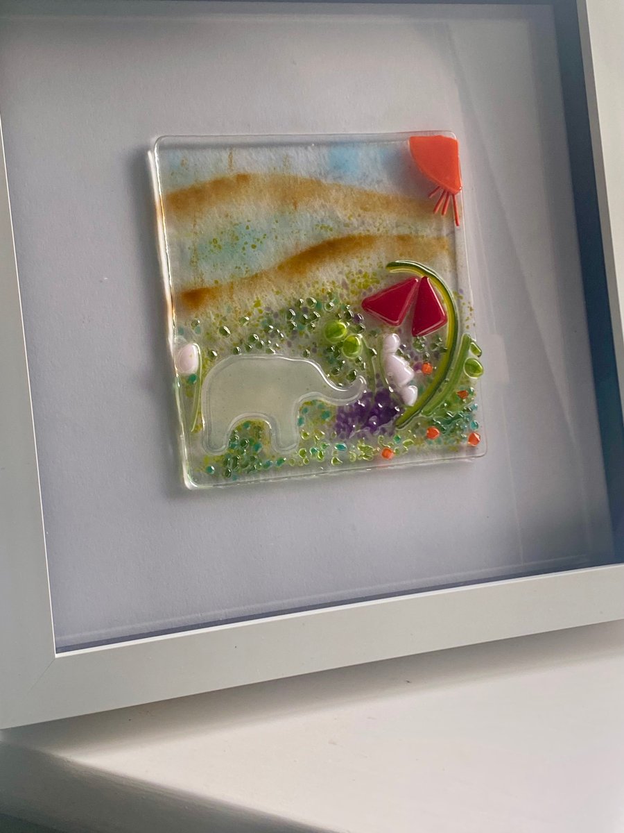 Handmade fused glass panel in a white frame