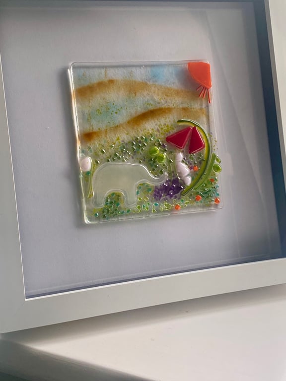 Handmade fused glass panel in a white frame