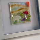 Handmade fused glass panel in a white frame