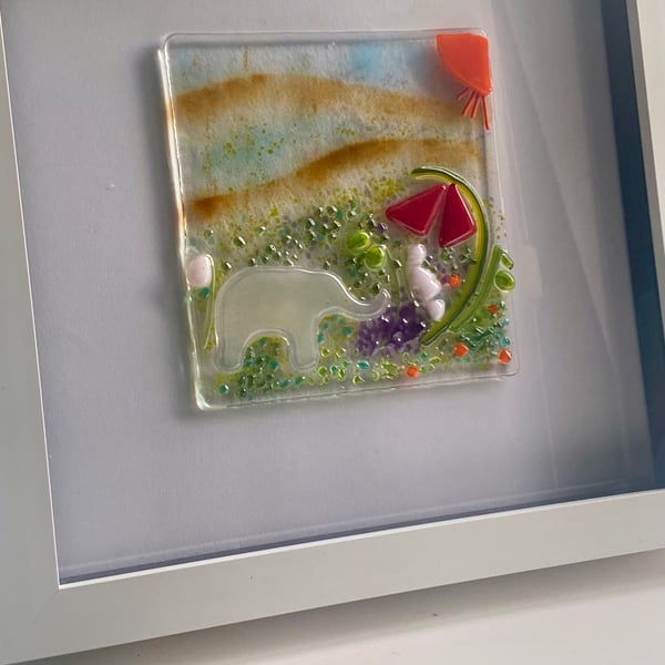 Handmade fused glass panel in a white frame