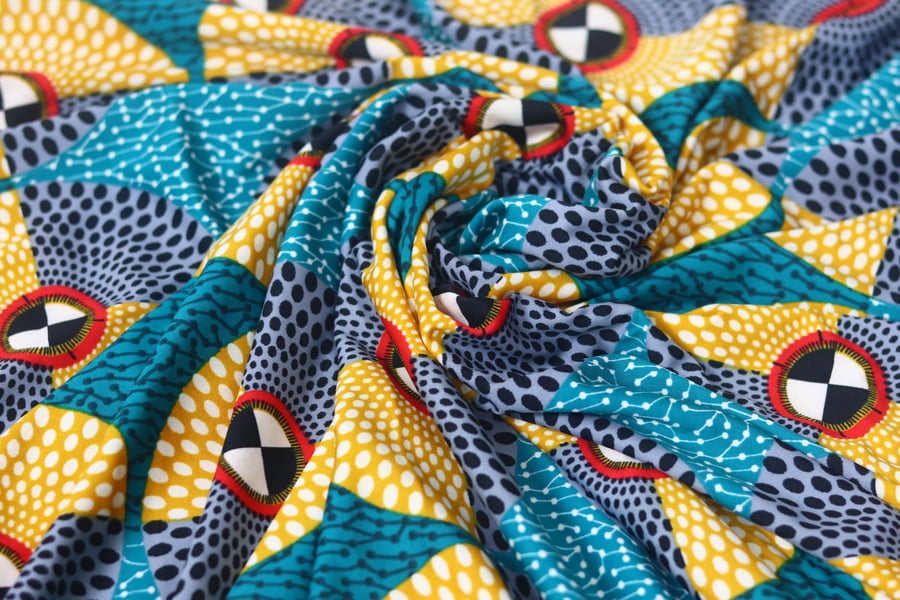 geometric discs lycra african print inspired stretch fabric sold by the yard