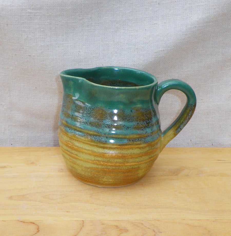 Jug or pitcher hand thrown in stoneware pottery ceramic