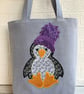 Penguin tote bag in pale blue with a paisley penguin in a purple bobble hat - Image 5