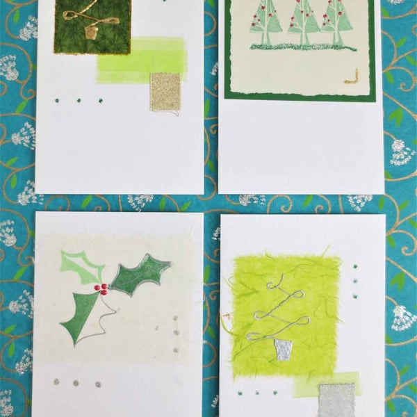 Four pack of handmade Christmas cards with trees and holly (f))