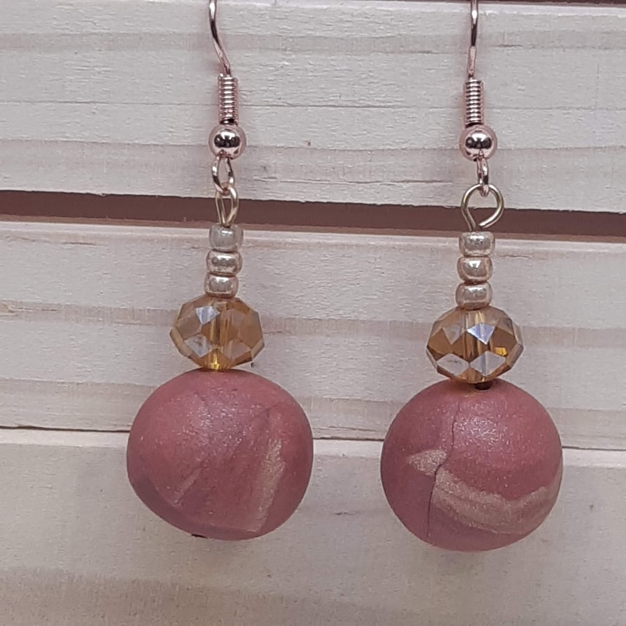Dangly polymer clay earrings in dark salmon pink and amber