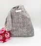 Reversible grey and patterned knot bag.  - Image 6