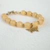 Handmade honey quartz handmade bracelet, with butterfly charm