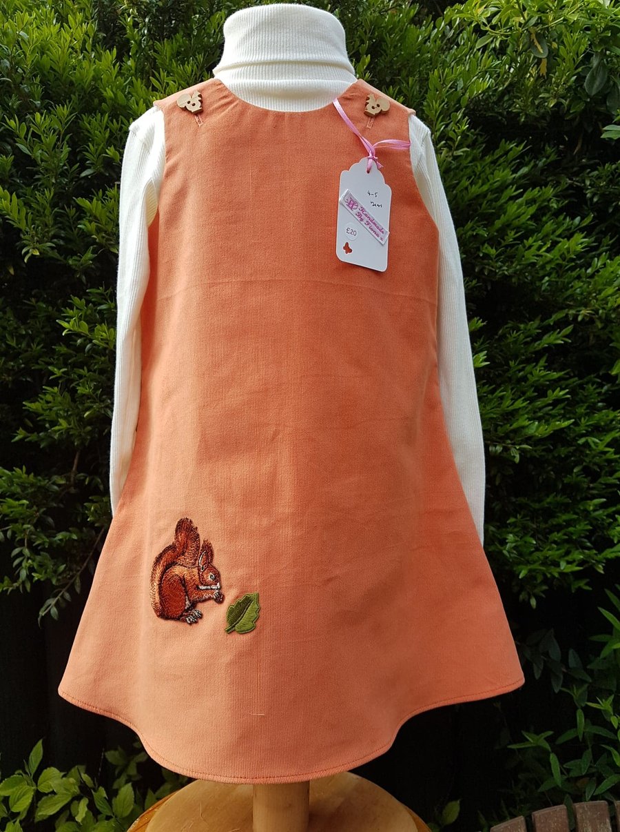 Age: 4-5y. Pumpkin baby needlecord pinafore dress. 