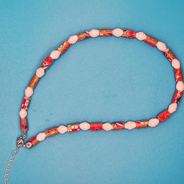 Ras de cou paper beaded necklace with an African inspired pattern