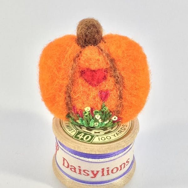 Pumpkin brooch.