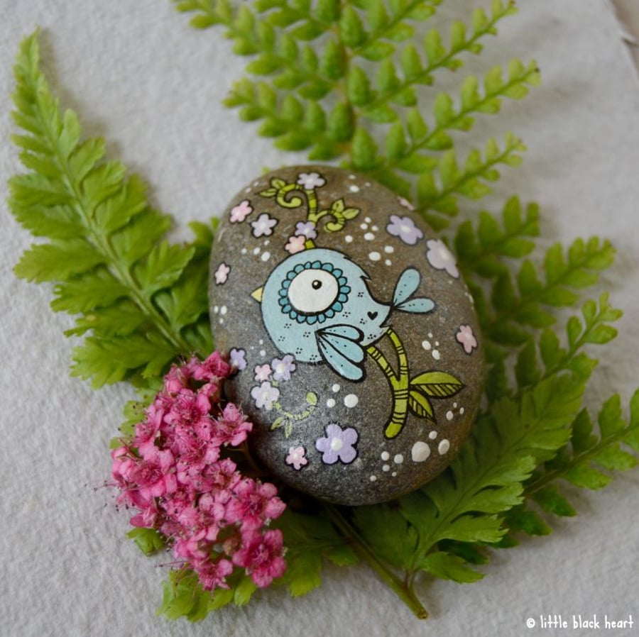 painted pebble - blue bird and blossom