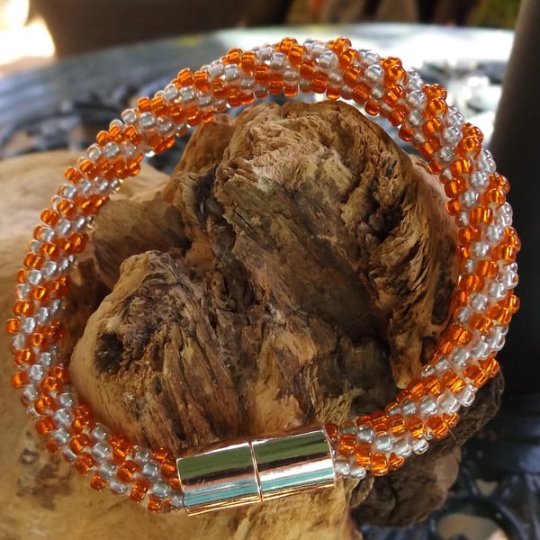 Orange and silver kumihimo bracelet