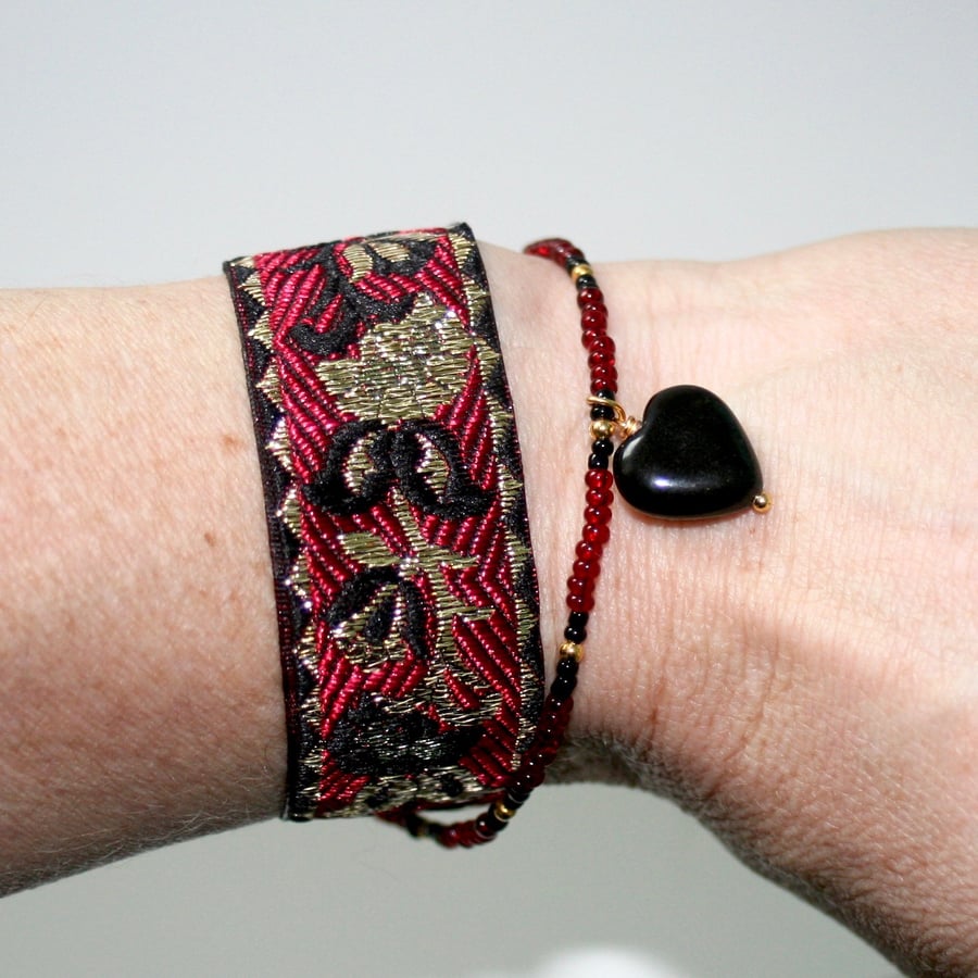 Black, red and gold ribbon cuff with black obsidian heart