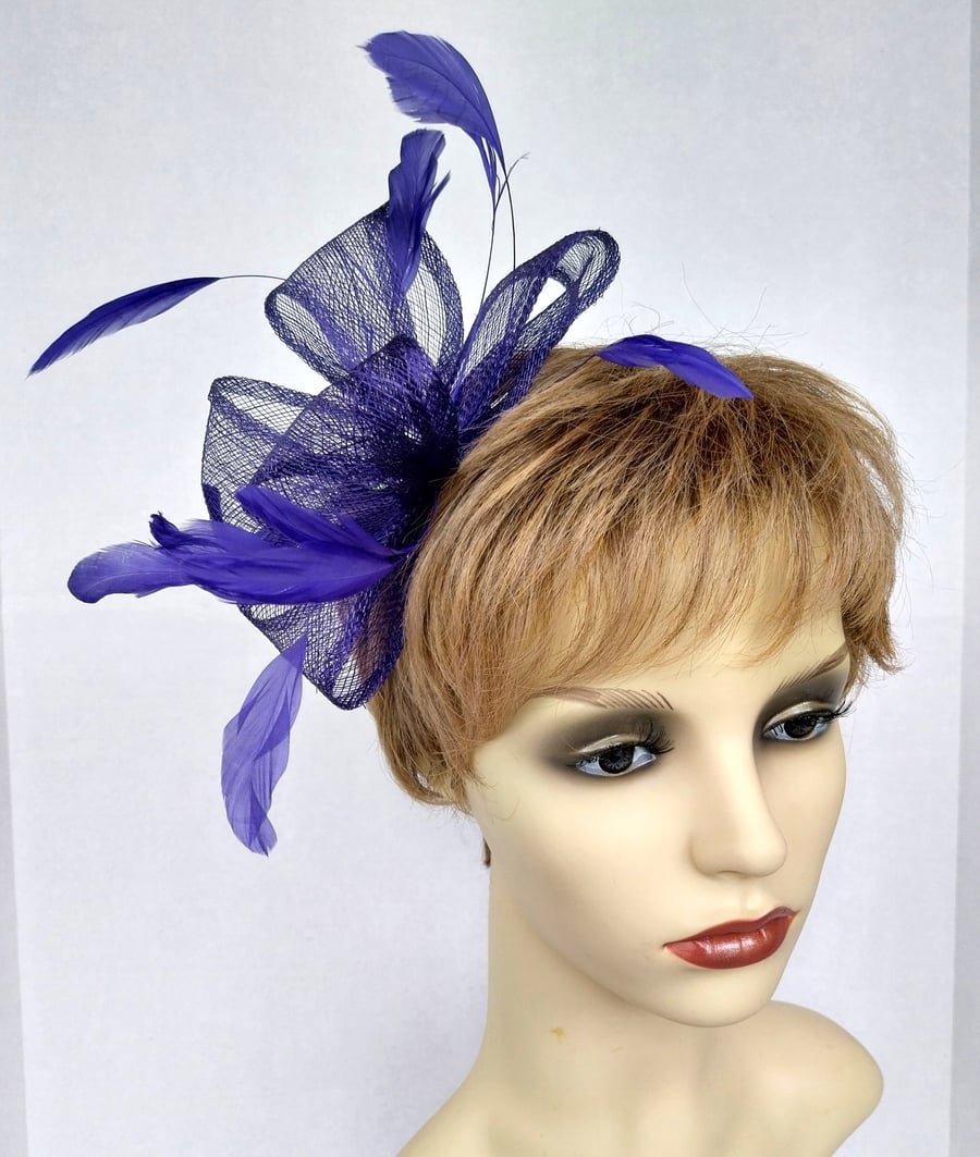 Pretty purple fascinator with feathers and crystals