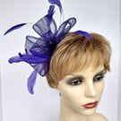 Pretty purple fascinator with feathers and crystals