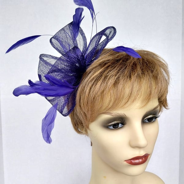 Pretty purple fascinator with feathers and crystals