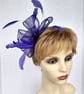 Pretty purple fascinator with feathers and crystals