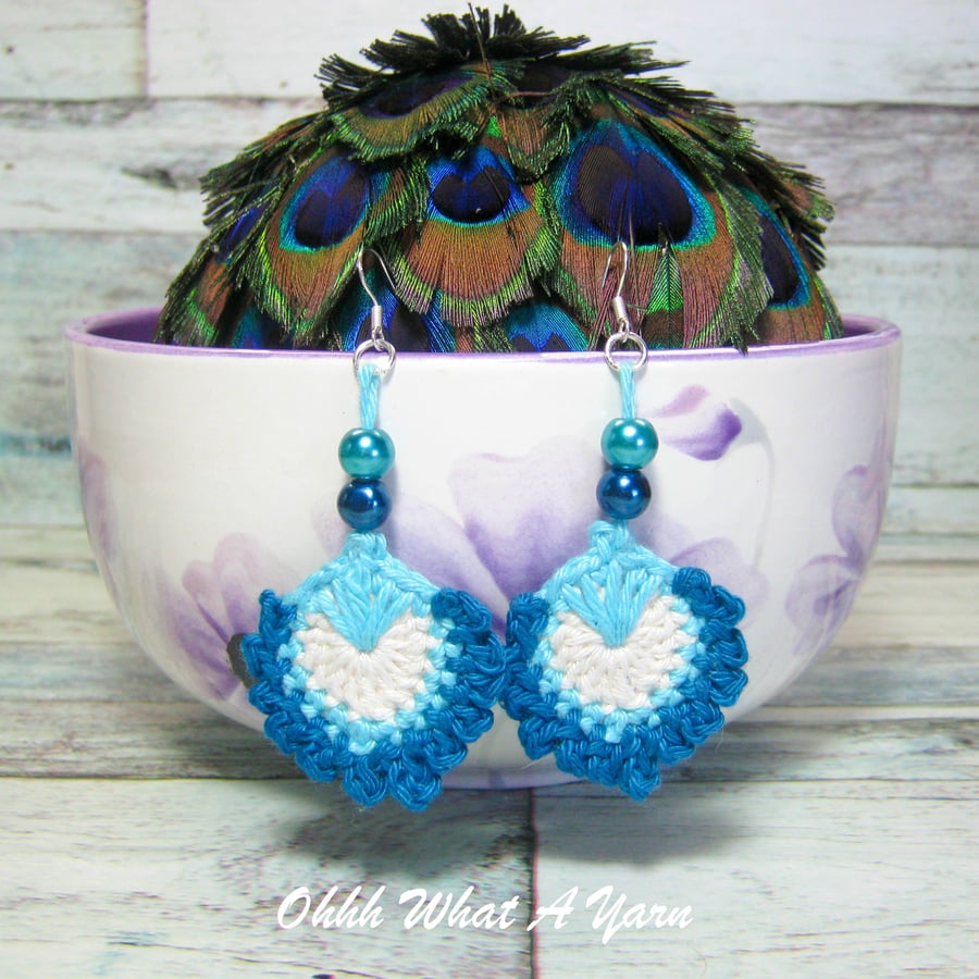 Crochet, embroidered and beaded peacock feather earrings. 