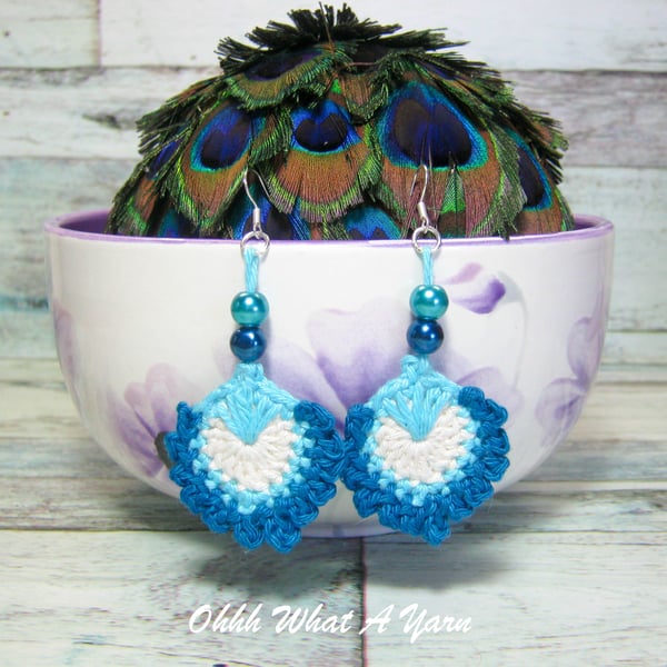 Crochet, embroidered and beaded peacock feather earrings. 