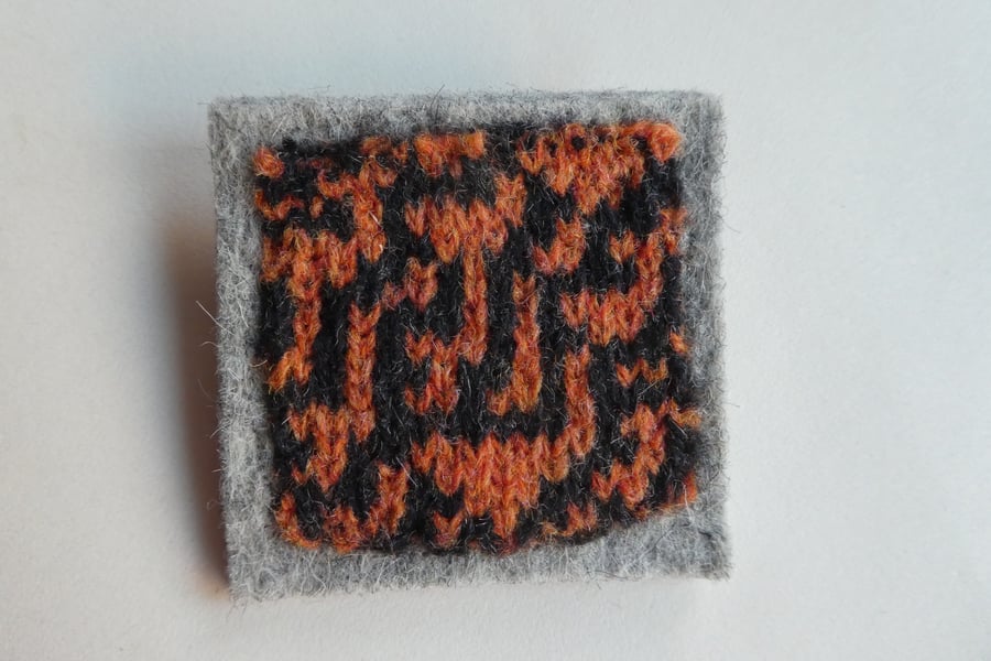 Rule 30 brooch - pale grey with orange and black, square, needle felted.