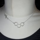Honeycomb with bee necklace
