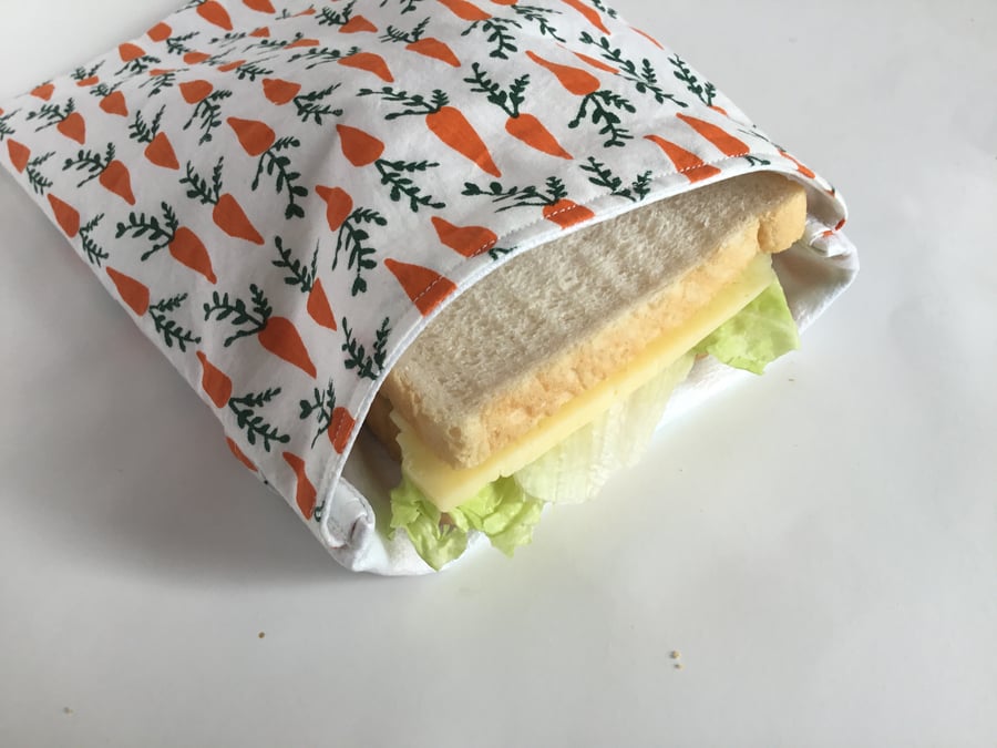 Large, re-usable, eco-friendly sandwich bag in carrot fabric with PUL lining.
