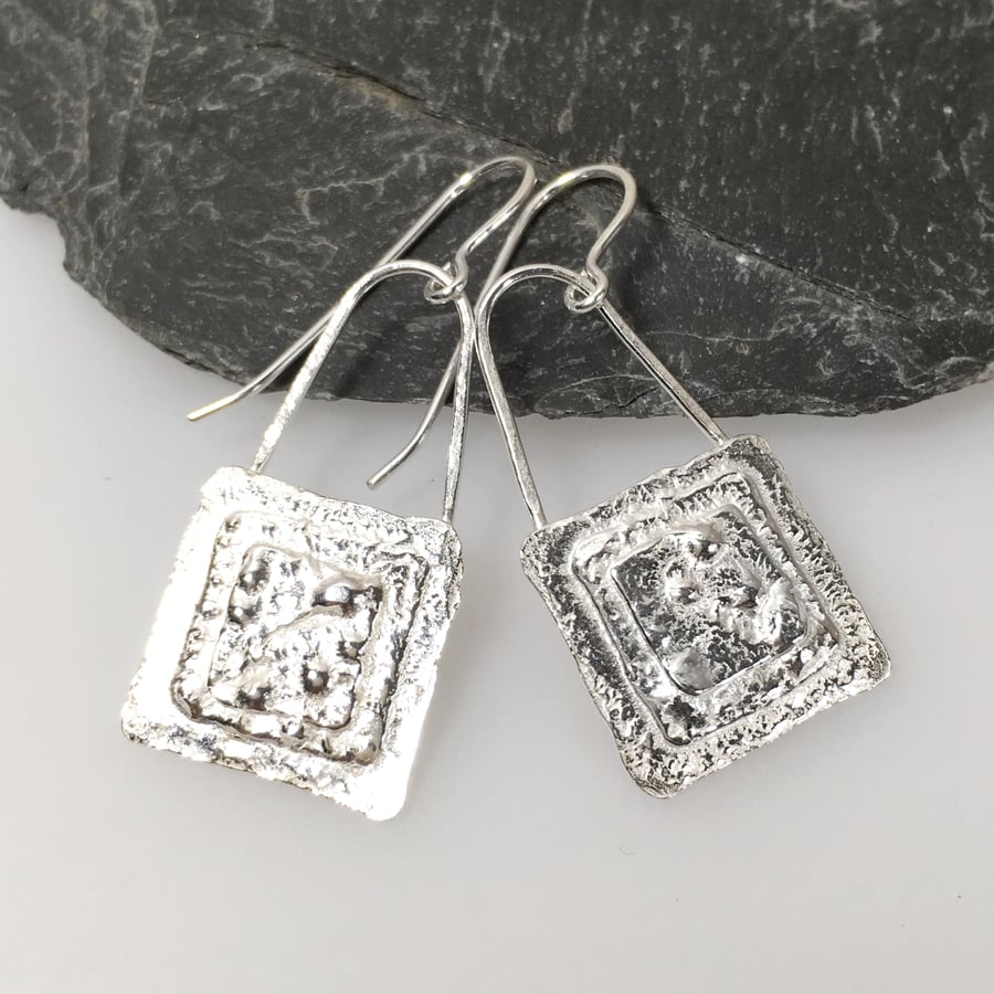  Sterling Silver textured square earrings.