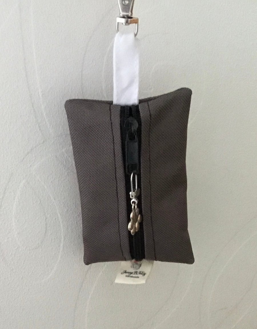 Grey dog bag carrier.