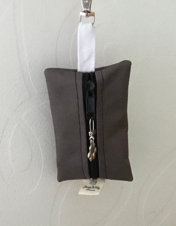 Grey dog bag carrier.