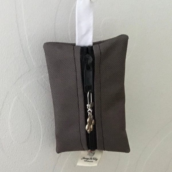 Grey dog bag carrier.