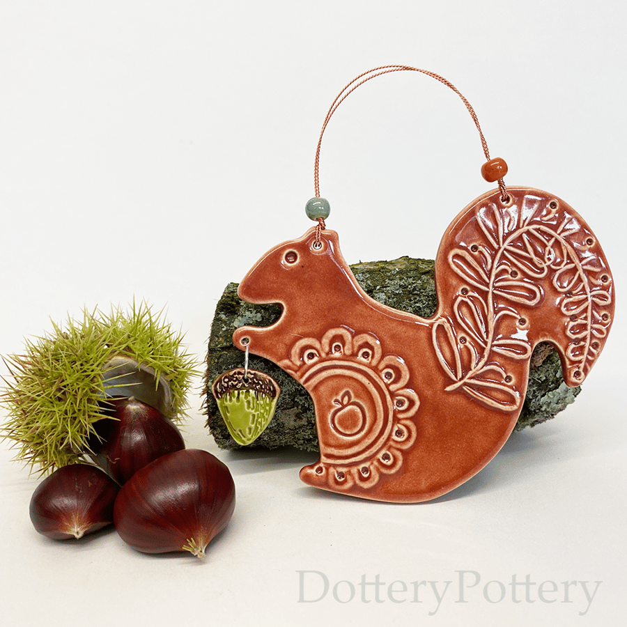 Ceramic squirrel with acorn decoration 