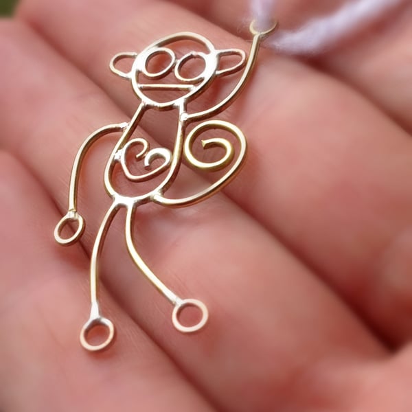 Mad monkeys from a childs drawing. Available in sterling silver or 9ct gold.
