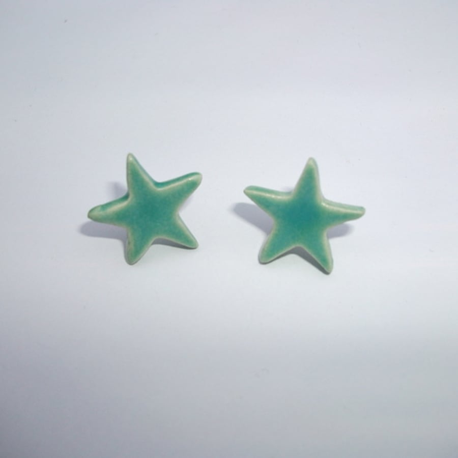 ice blue ceramic star earrings