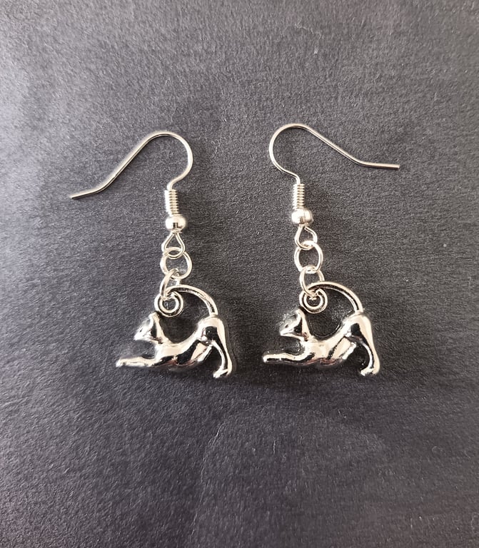 Silver stretching cat charm dangle earrings 