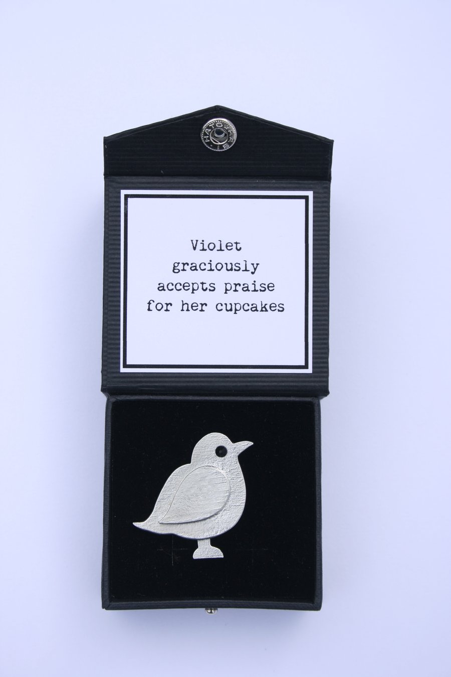 Violet graciously accepts praise for her cupcakes