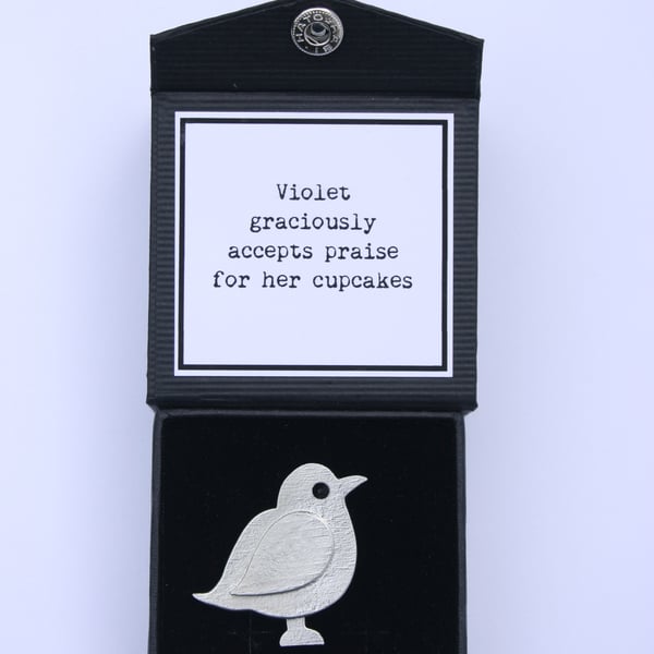 Violet graciously accepts praise for her cupcakes