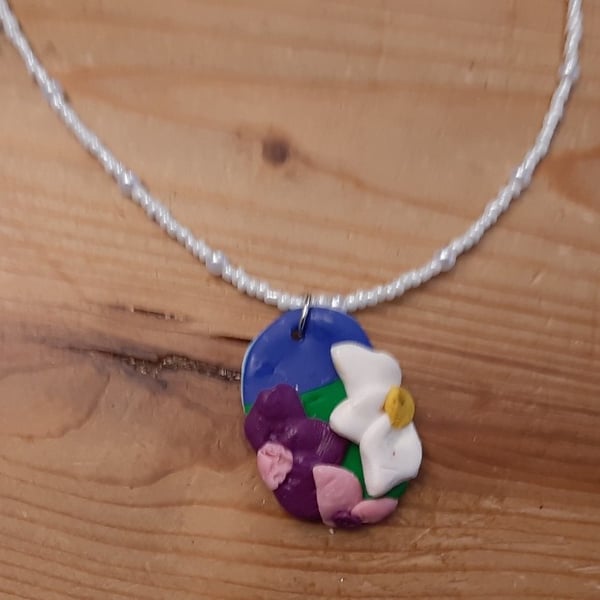 Flower Pendant on a White Beaded Necklace