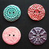 Set of four large ceramic buttons