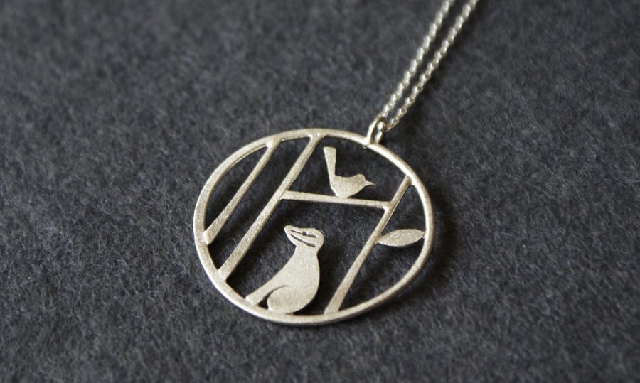Edge of the woods badger and bird necklace
