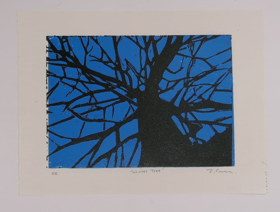 "Winter Tree" lino cut print. 15 x 21 cm. Black tree on Blue. Seawhite Paper. OE