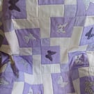 quilt with spring butterflies, in purples and white