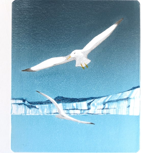 Gulls along the cliffs and coast original monoprint with added details.