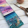 Embroidered up-cycled sunset seascape bookmark. 